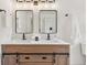 Bathroom boasting a double sink vanity, updated fixtures, and modern design at 3422 Maplehurst Dr, Decatur, GA 30032