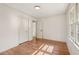 Cozy bedroom featuring hardwood floors, a closet, and a window that allows ample natural light at 3422 Maplehurst Dr, Decatur, GA 30032