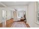 Primary bedroom with bright windows, hardwood floors, and ensuite bathroom with tiled floors at 3422 Maplehurst Dr, Decatur, GA 30032