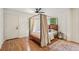 Cozy bedroom with hardwood floors, a four-poster bed, and natural light from the windows at 3422 Maplehurst Dr, Decatur, GA 30032