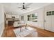 Inviting living room with hardwood floors, decorative ceiling, and large windows providing plenty of natural light at 3422 Maplehurst Dr, Decatur, GA 30032