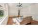 Comfortable living room with hardwood floors, paneled walls, and large windows offering views to the front yard at 3422 Maplehurst Dr, Decatur, GA 30032