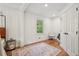 Spacious main bedroom featuring hardwood floors, a large window, and a sitting area at 3422 Maplehurst Dr, Decatur, GA 30032