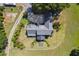 A beautiful home from above with a fire pit, manicured lawn and landscaping, and mature trees at 3842 Ernest W Barrett Sw Pkwy, Marietta, GA 30064