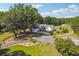 Aerial view of the home and surrounding land, showcasing curb appeal and an expansive driveway at 3842 Ernest W Barrett Sw Pkwy, Marietta, GA 30064