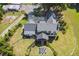 Aerial view of the home and backyard, showcasing the landscape and fire pit area at 3842 Ernest W Barrett Sw Pkwy, Marietta, GA 30064