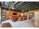 Relaxing basement area with wood paneling, an exposed ceiling and ample seating at 3842 Ernest W Barrett Sw Pkwy, Marietta, GA 30064
