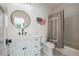 Clean, well-lit bathroom featuring a modern vanity, round mirror, and subway tile shower at 3842 Ernest W Barrett Sw Pkwy, Marietta, GA 30064