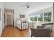 Bright, airy bedroom with hardwood floors and comfortable seating. Great natural light and views at 3842 Ernest W Barrett Sw Pkwy, Marietta, GA 30064