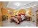 Charming bedroom with wood walls, a comfortable bed and stylish furnishings at 3842 Ernest W Barrett Sw Pkwy, Marietta, GA 30064