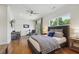 Comfortable bedroom with hardwood floors, desk, and balcony access, great for relaxation at 3842 Ernest W Barrett Sw Pkwy, Marietta, GA 30064