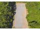 Aerial view of a meticulously groomed equestrian arena surrounded by verdant trees, ideal for horse enthusiasts at 3842 Ernest W Barrett Sw Pkwy, Marietta, GA 30064