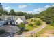Aerial view of the home's exterior, showing the driveway and well-manicured front yard at 3842 Ernest W Barrett Sw Pkwy, Marietta, GA 30064