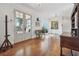Bright foyer with beautiful hardwood floors, a decorative chair, and double glass doors leading to the outside at 3842 Ernest W Barrett Sw Pkwy, Marietta, GA 30064