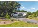 Modern farmhouse with black trim, three-car garage and extensive front lawn at 3842 Ernest W Barrett Sw Pkwy, Marietta, GA 30064