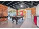 Game room featuring a pool table, bar area, and an exposed ceiling at 3842 Ernest W Barrett Sw Pkwy, Marietta, GA 30064