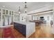Bright kitchen with marble island, open to dining and living areas, and hardwood floors at 3842 Ernest W Barrett Sw Pkwy, Marietta, GA 30064