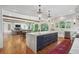 Gourmet kitchen featuring a marble island, custom cabinetry, and hardwood floors at 3842 Ernest W Barrett Sw Pkwy, Marietta, GA 30064