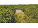 Aerial view of the land with a cleared area, surrounded by lush trees and greenery at 3842 Ernest W Barrett Sw Pkwy, Marietta, GA 30064