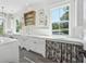 Bright laundry room featuring white cabinets, farmhouse sink, and decorative accents at 3842 Ernest W Barrett Sw Pkwy, Marietta, GA 30064