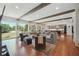 Open-concept living room showcases hardwood floors, backyard views and beamed ceilings at 3842 Ernest W Barrett Sw Pkwy, Marietta, GA 30064