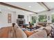Comfortable living room with shiplap walls, beamed ceiling and plenty of natural light at 3842 Ernest W Barrett Sw Pkwy, Marietta, GA 30064