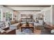 Spacious living room is perfect for entertaining with comfortable seating and backyard views at 3842 Ernest W Barrett Sw Pkwy, Marietta, GA 30064