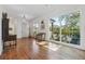 This sunny sitting area features hardwood floors, and large windows overlooking the backyard at 3842 Ernest W Barrett Sw Pkwy, Marietta, GA 30064