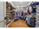 Well-organized walk-in closet with ample shelving and hanging space for clothes and shoes at 3842 Ernest W Barrett Sw Pkwy, Marietta, GA 30064