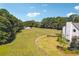The fenced backyard includes a lush green landscape, providing a beautiful backdrop for the home at 3842 Ernest W Barrett Sw Pkwy, Marietta, GA 30064