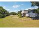 The expansive yard is surrounded by a wooden fence, providing privacy and defining property lines at 3842 Ernest W Barrett Sw Pkwy, Marietta, GA 30064
