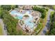 An aerial view of a community pool with a lazy river, slide, and other water features at 428 Redwood Trl, Canton, GA 30114