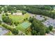 Aerial view of park, playground, basketball court, and parking in a forested neighborhood at 428 Redwood Trl, Canton, GA 30114