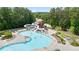 The aerial view captures a community pool featuring a large slide, sun loungers, and a winding swimming area at 428 Redwood Trl, Canton, GA 30114