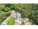 Aerial view of the home nestled among lush trees in a beautiful neighborhood at 428 Redwood Trl, Canton, GA 30114