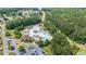 An aerial view of a community pool with a lazy river, slide, and other water features surrounded by green trees at 428 Redwood Trl, Canton, GA 30114