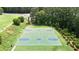 Aerial view of neighborhood basketball courts surrounded by lush trees and green space at 428 Redwood Trl, Canton, GA 30114