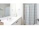 Bathroom features a single sink vanity and a shower with a shower curtain at 428 Redwood Trl, Canton, GA 30114