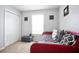 Bright bedroom with a cozy daybed, plush pillows, and ample closet space at 428 Redwood Trl, Canton, GA 30114