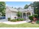 Inviting front porch with a rocking chair and charming curb appeal at 428 Redwood Trl, Canton, GA 30114