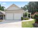Home featuring a spacious two-car garage and landscaped front yard at 428 Redwood Trl, Canton, GA 30114