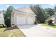 Home featuring a spacious two-car garage at 428 Redwood Trl, Canton, GA 30114