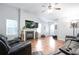 Living room featuring hardwood floors, fireplace, and lots of light at 428 Redwood Trl, Canton, GA 30114