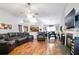Living room featuring hardwood floors, fireplace, and ceiling fan at 428 Redwood Trl, Canton, GA 30114