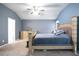 The spacious main bedroom has a tray ceiling, and neutral carpeting at 428 Redwood Trl, Canton, GA 30114