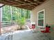 Covered patio area perfect for enjoying the outdoors in a peaceful, shaded setting at 428 Redwood Trl, Canton, GA 30114