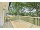 New wooden backyard deck with a scenic view of the lush green backyard at 1261 Cliffwood Se Dr, Smyrna, GA 30080