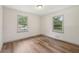Comfortable bedroom with hardwood floors, neutral paint, and double windows at 1261 Cliffwood Se Dr, Smyrna, GA 30080