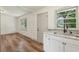 Cozy kitchen featuring white cabinetry, marble counters, and modern fixtures at 1261 Cliffwood Se Dr, Smyrna, GA 30080