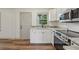 This kitchen features modern appliances, light countertops and ample natural light at 1261 Cliffwood Se Dr, Smyrna, GA 30080